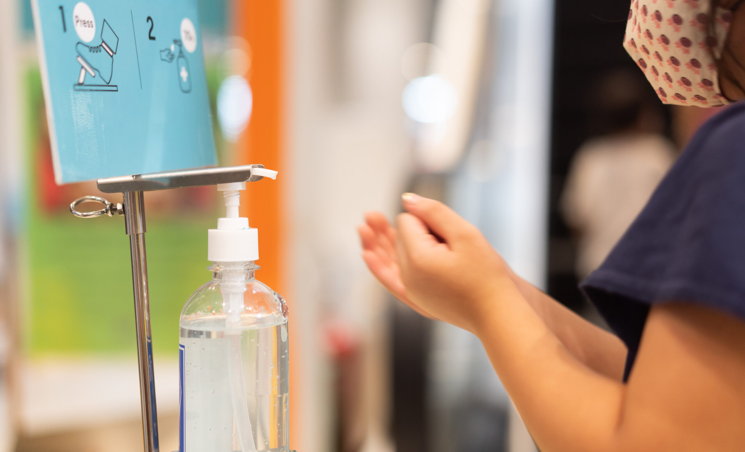 Child with Hand Sanitiser station